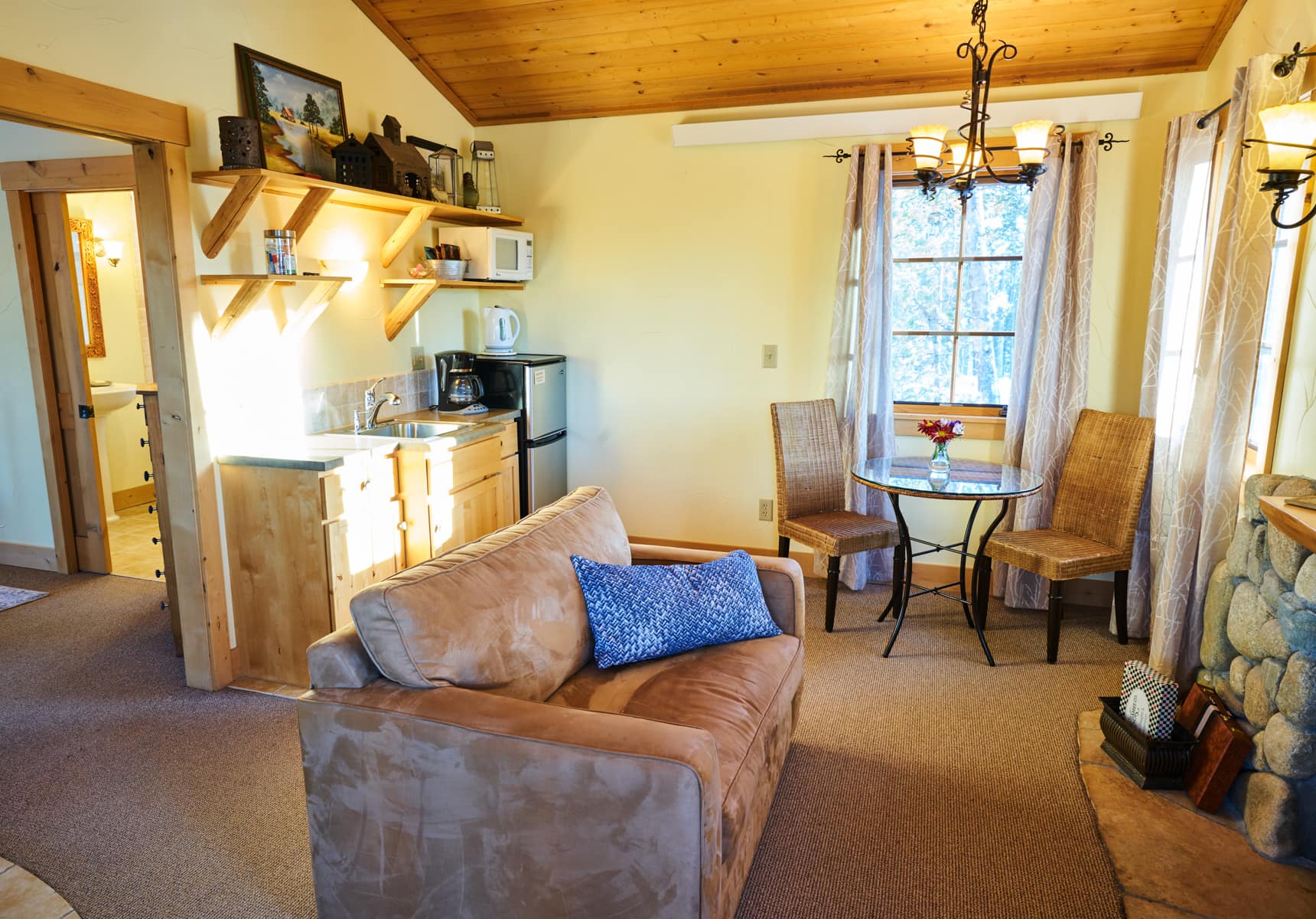 Meadowcreek cabin living room with kitchenette and seating area
