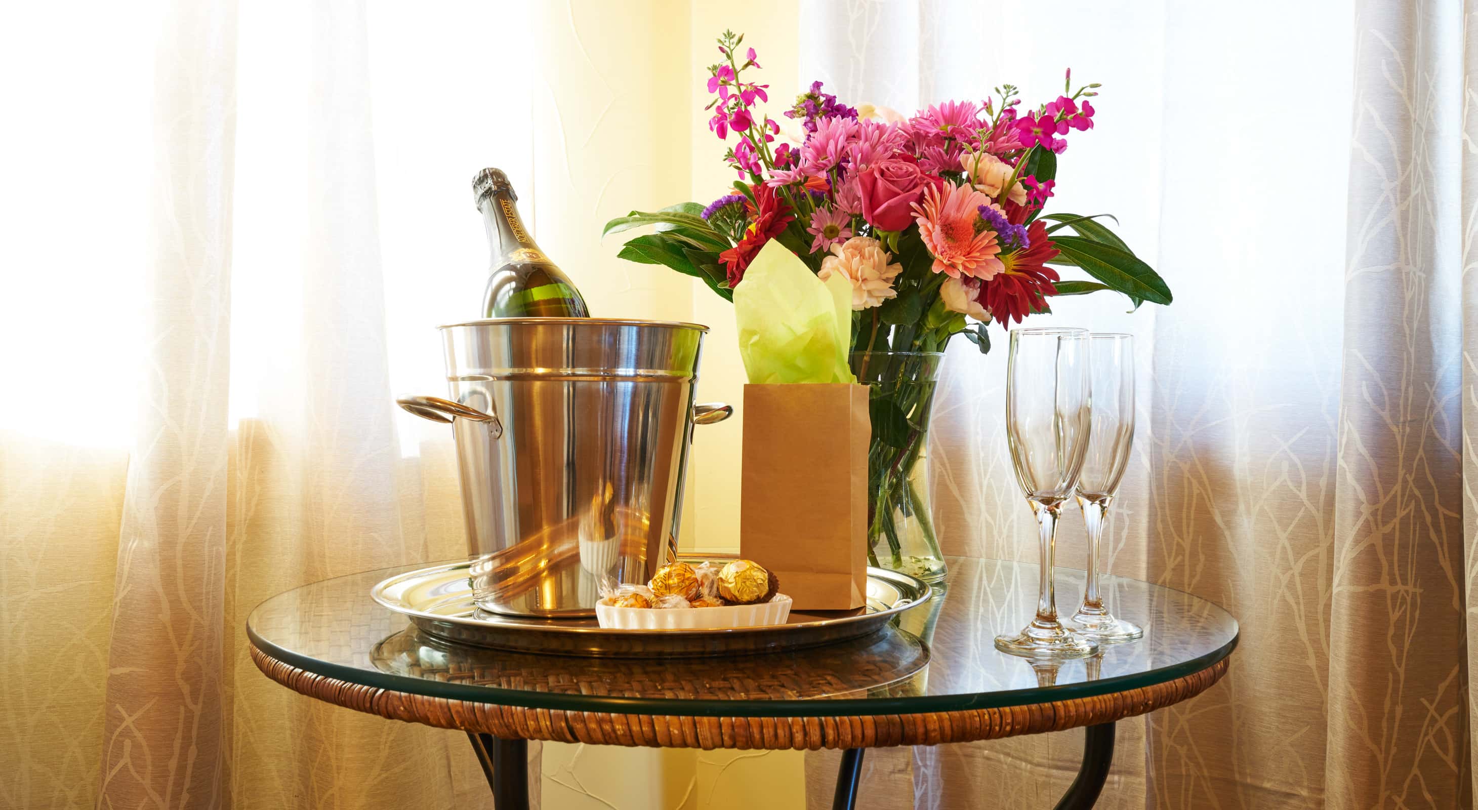 Romance package with flowers, chocolate, and champagne