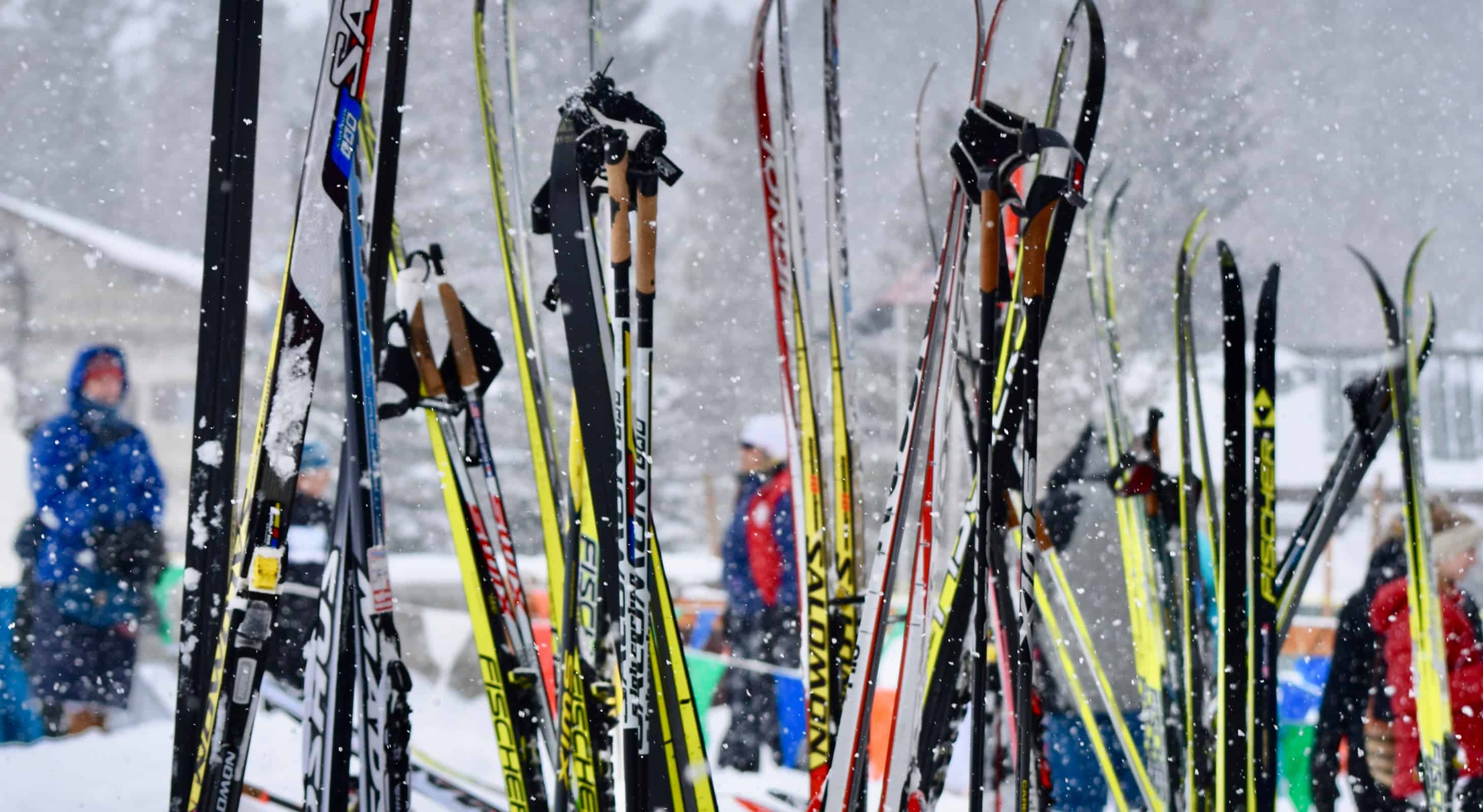 skis and ski poles stuck in the snow